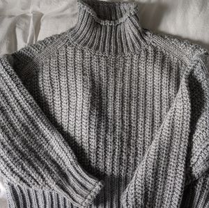 Grey turtleneck chunky knit sweater